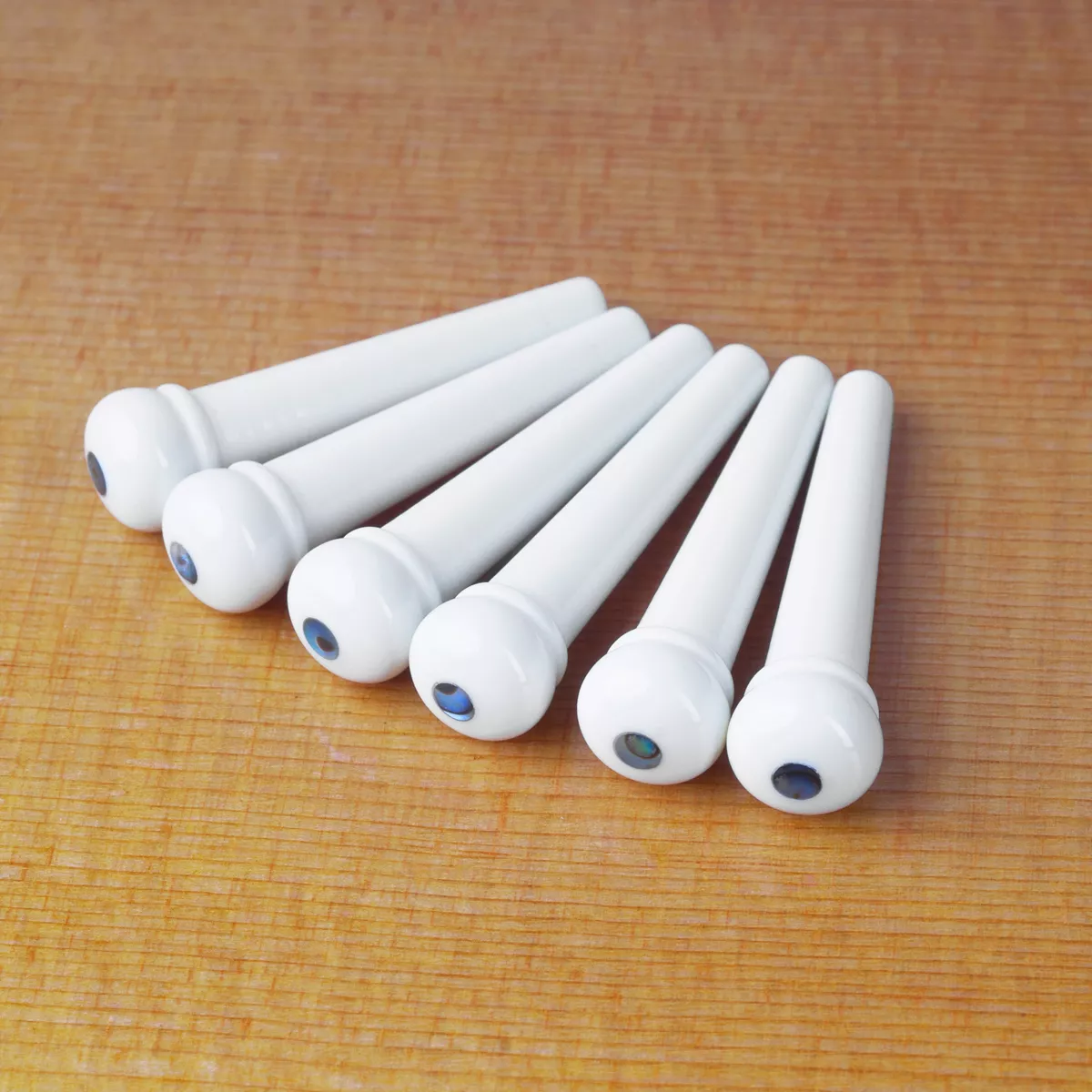 Pines de puente blanco ondulado con incrustación de Abalone Pines de puente blanco ondulado con incrustación de Abalone