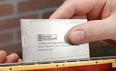 Calibrador de acción de cuerdas