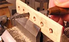 Forma de la placa de arce - Corte de muescas de cuerda