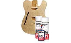 Blue guitar with stains and aerosol lacquer