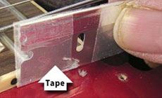 Putting tape on a razor