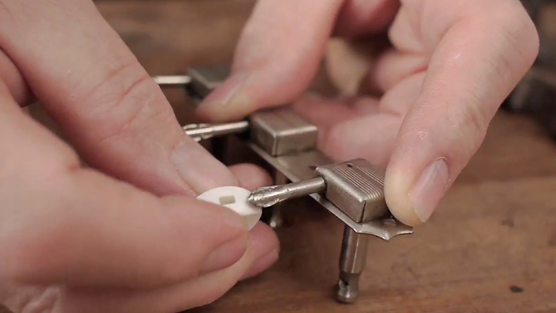 A neat trick for drilling perfectly centered holes in guitar tuners
