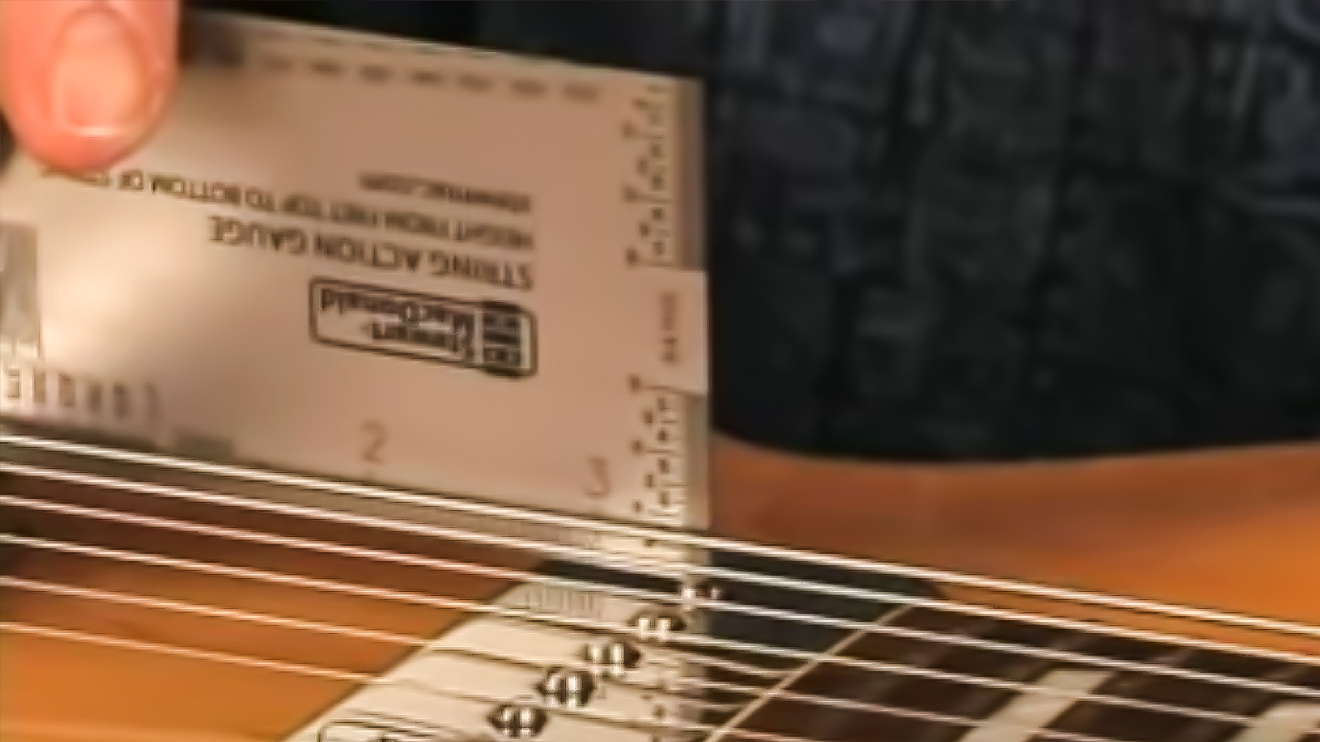 Calibrador de acción de cuerdas